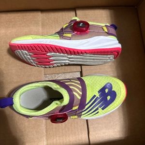 Girls size 13 new balance shoes with tightening knob.